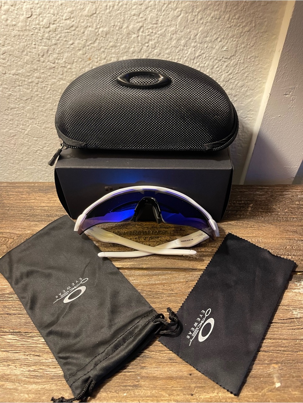 Oakley White Frame Sunglasses with Blue Mirrored Lens